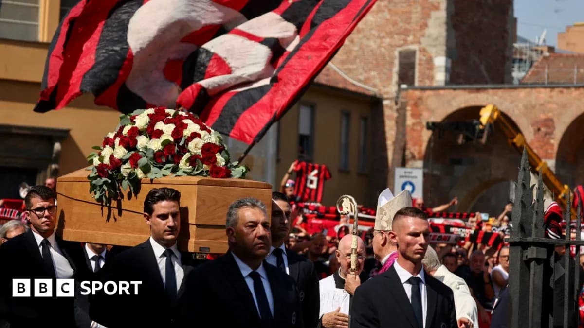 Funeral procession with coffin and mourners present
