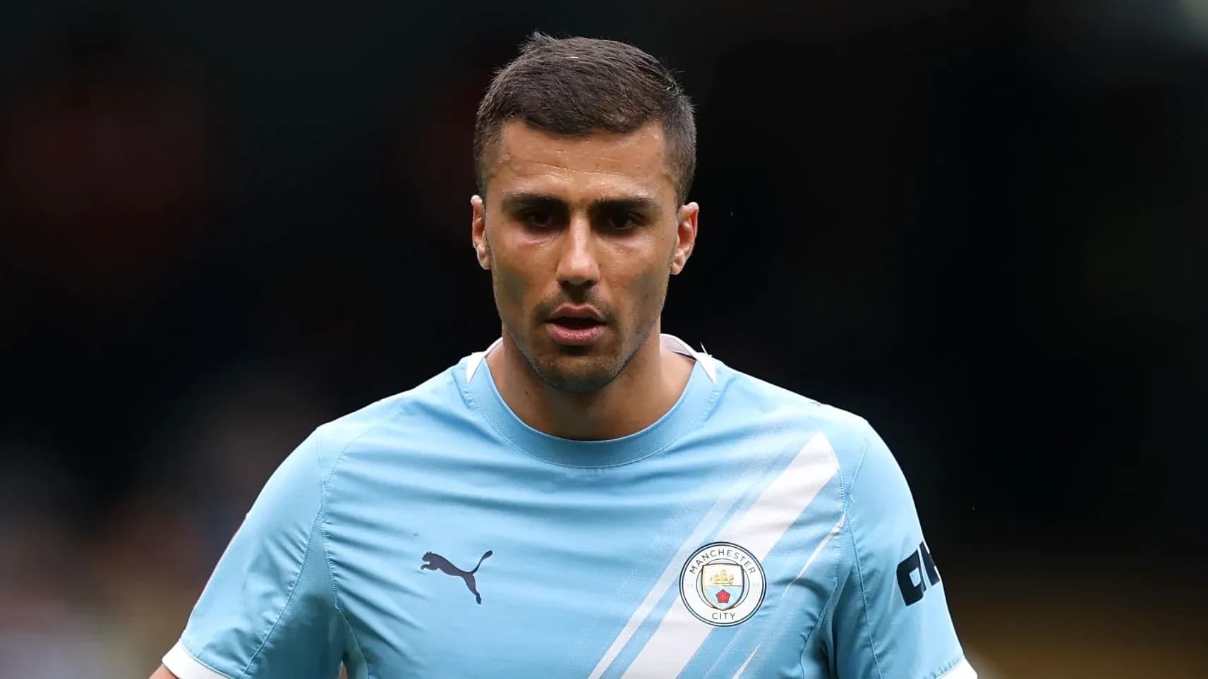 Jugador de Manchester City en camiseta azul