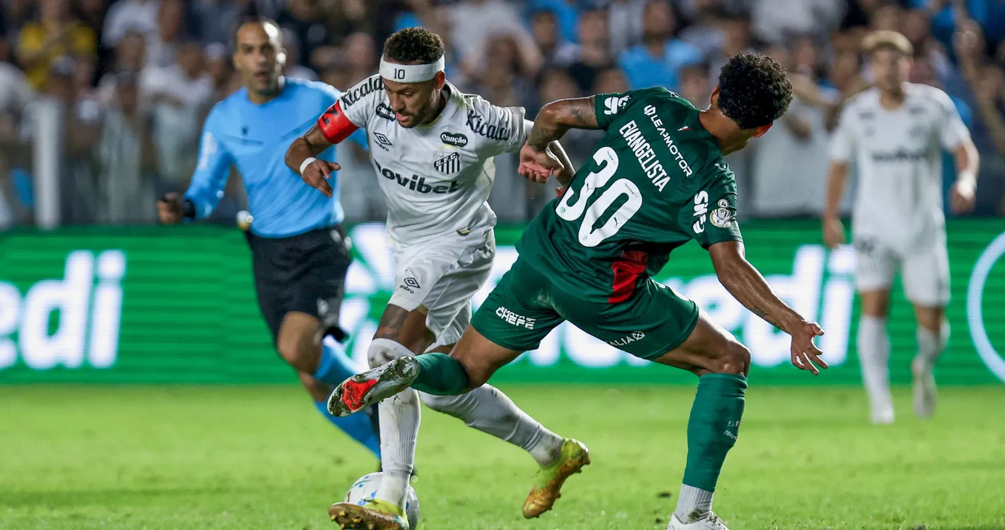 Neymar dribbling past a defender during match