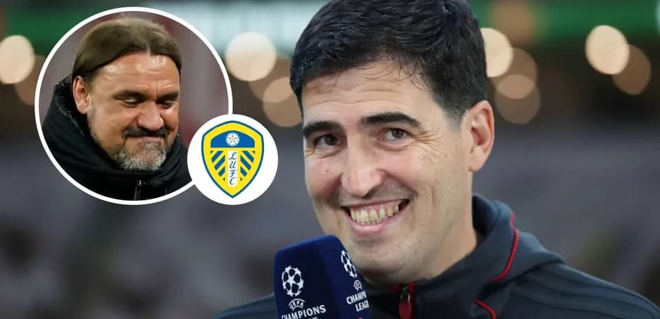 Entrenador sonriente en entrevista con micrófono