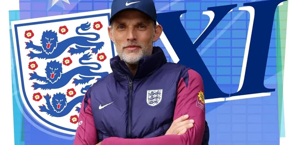 Entrenador de Inglaterra posando frente al escudo