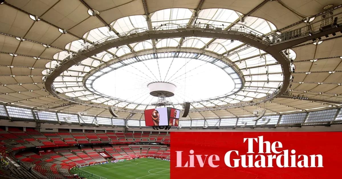 Interior view of a stadium with a large roof