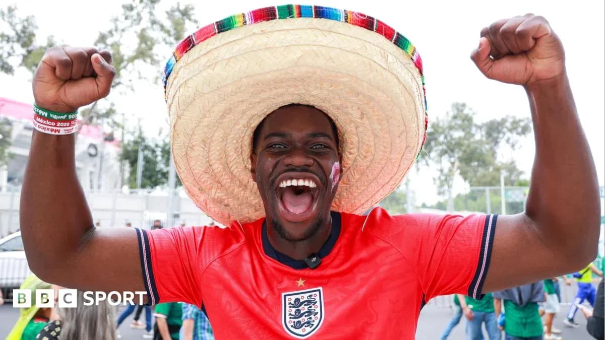 A fan in a sombrero celebrating at a stadium