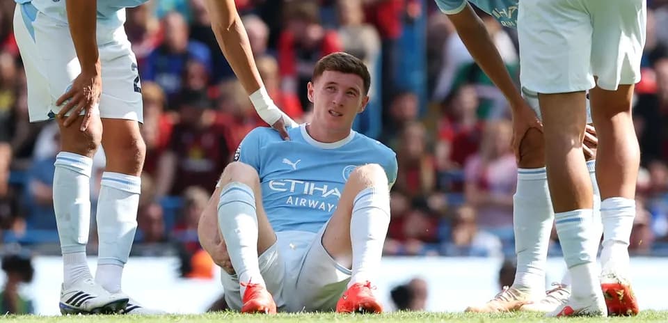 Jugador de Manchester City sentado en el campo