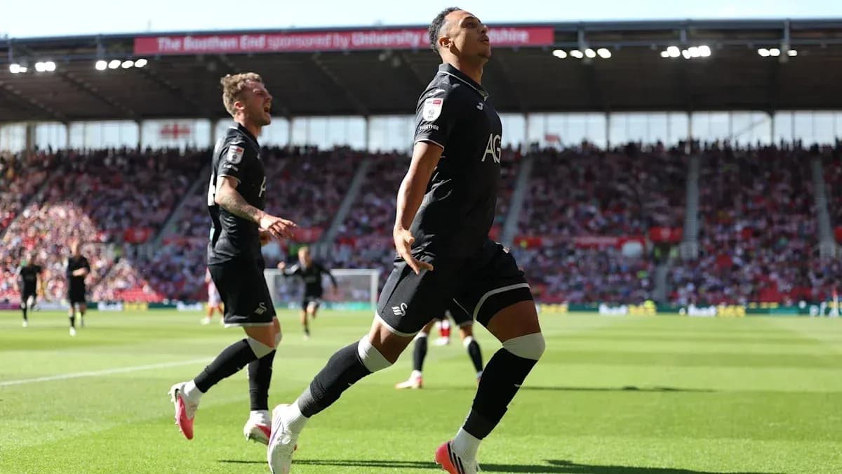 Jugador de Swansea celebrando un gol en el campo Jugador de Swansea celebrando un gol en el campo