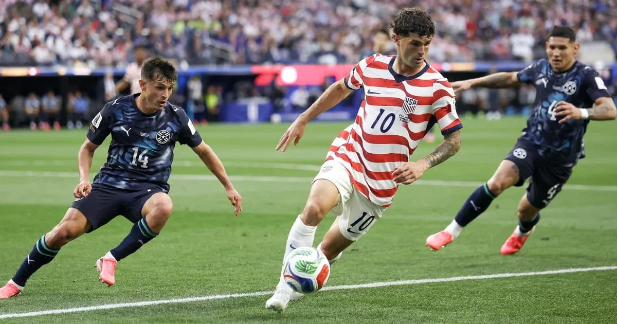 Cristian Pulisic dribbling past two defenders during match Cristian Pulisic dribbling past two defenders during match
