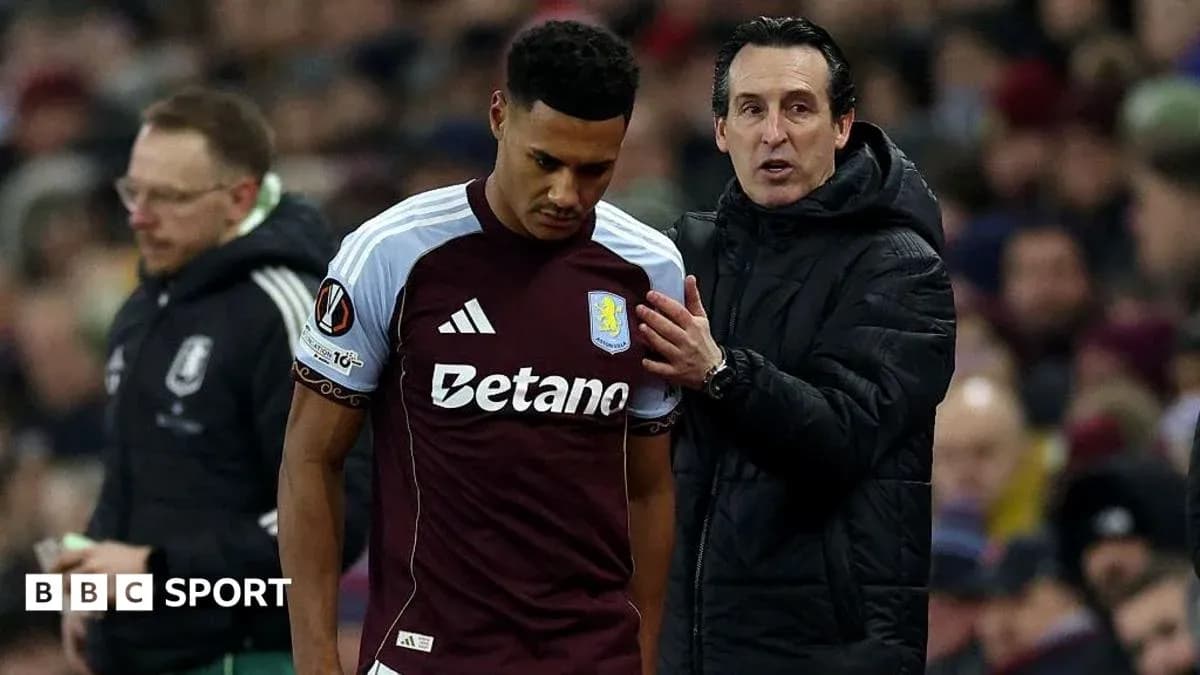 Entrenador hablando con jugador de Aston Villa en el campo Entrenador hablando con jugador de Aston Villa en el campo