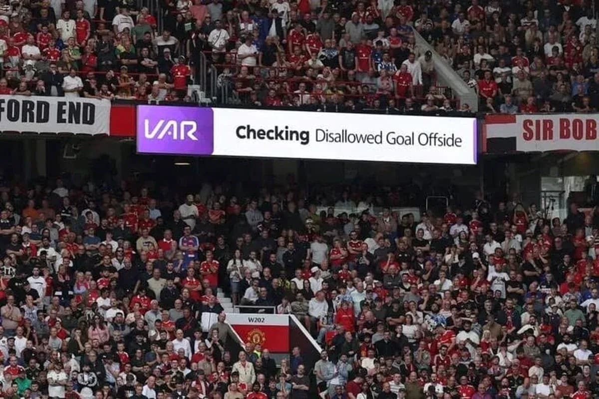 A crowd watching VAR decision about disallowed goal A crowd watching VAR decision about disallowed goal